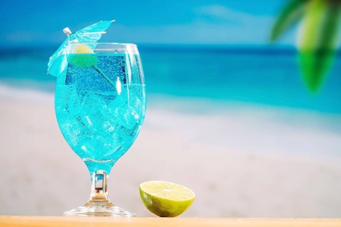 Glass cooling blue drink sliced lime