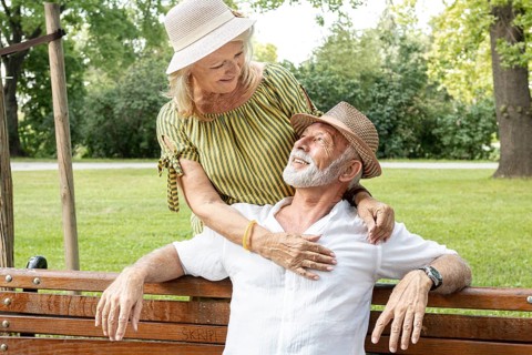 Smiley woman looking his man eyes