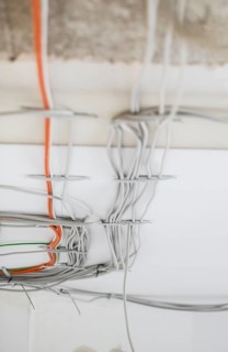Electric cable on the ceiling of a flat