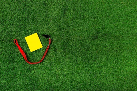 Football composition with copyspace yellow card