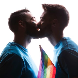 Gay couple kissing tenderly