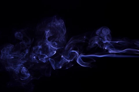 Movement purple smoke abstract black background