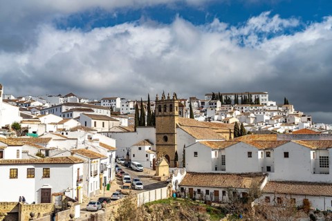 The white houses of the old town with the church Iglesia de Padre Jesus