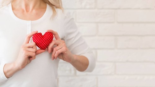 Close up woman with little heart
