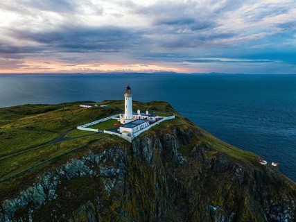 Sunset over Mull of Galloway Lighthouse from a drone