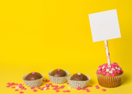 Delicious sweet candies cake with paper stick