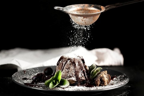 Front view chocolate cake with powdered sugar