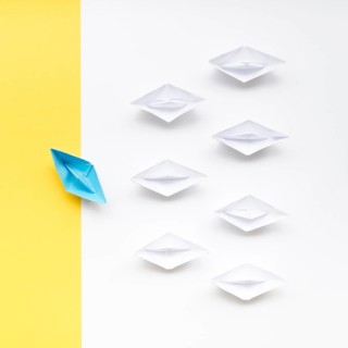 Creative arrangement individuality concept paper boats