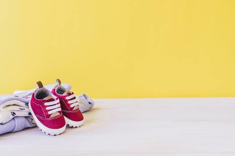 Newborn concept with shoes clothes
