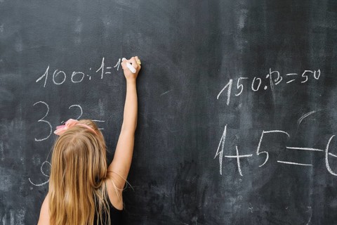 Girl solving math exercise