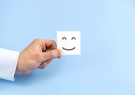 Top view arrangement with smiley emoji card