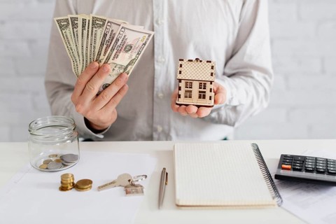 Realtor money wooden house
