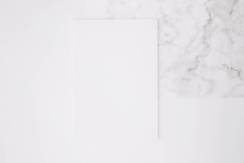 Blank paper white desk background