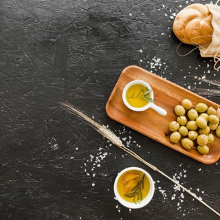 Desktop with olives bread oil