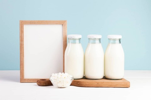 Wooden frame with bottles milk