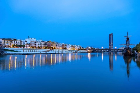 Triana neighbourhood on the banks of the Guadalquivir River at dusk