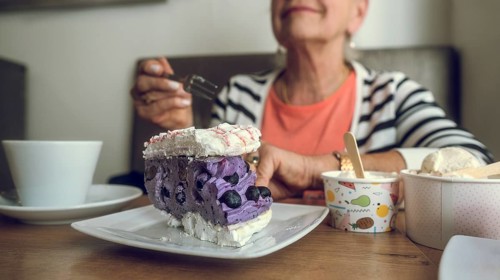 In a cafe. Colorful cake