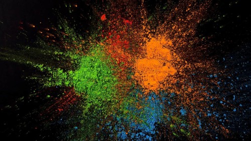 Splatted green blue orange color black background