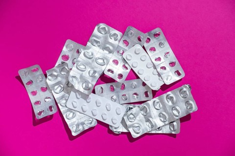 Empty tablet blister pack against a monochrome background