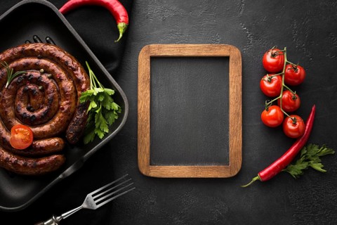 Top view delicious grilled sausage table