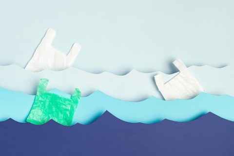 Top view paper ocean waves plastic bags