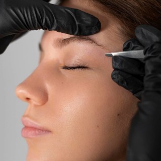 Close up woman getting her eyebrows done