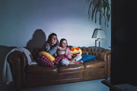 Girls enjoying movie dark room