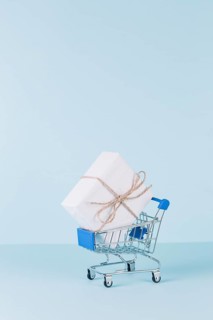 White package shopping cart blue background