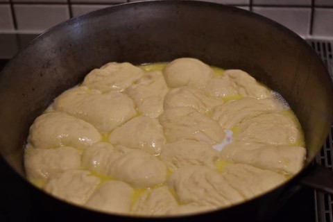 Preparation of steam noodles in rustic old steam noodle pan