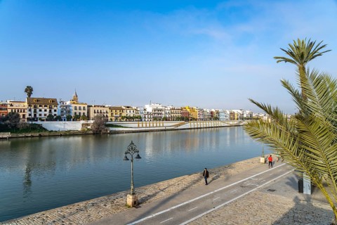 Waterfront and the colourful houses of the Triana district on the Guadalquivir River