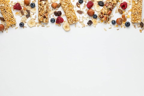 Top view breakfast cereal bars with fruits copy space