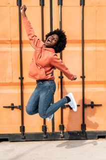 Portrait young female jumping 3