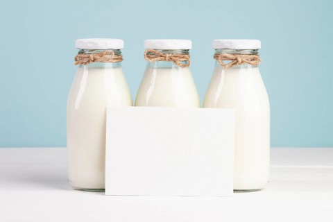 Milk bottles copy space card