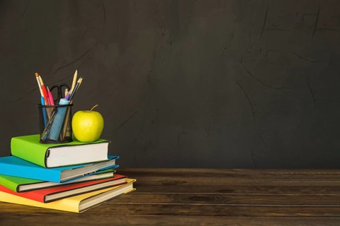 Stationary apple pile books table