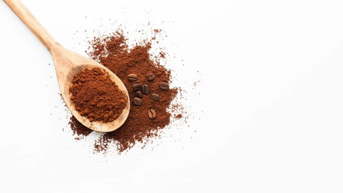 Close up scoop with coffee copy space