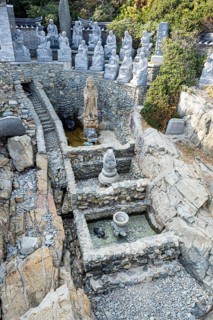 Lucky fountain with stone figures
