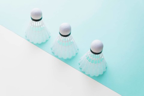 Three white shuttlecock dual background