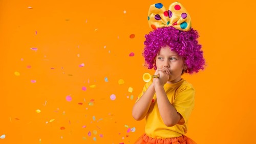 Girl with confetti clown costume