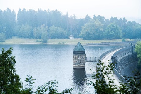 Dam wall of the Dreilaegerbach dam near Roetgen in the fog