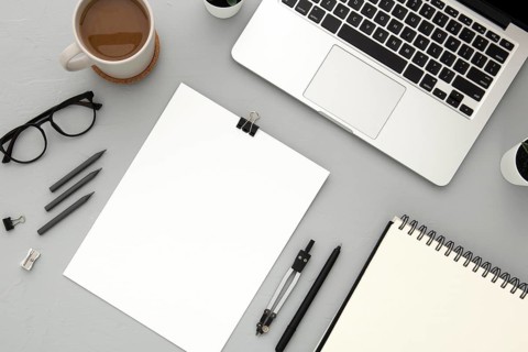 Arrangement desk elements with empty notebook grey background