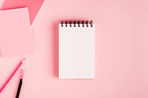 Notepad office supplies colored surface