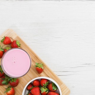 Flat lay strawberry smoothie with fruits