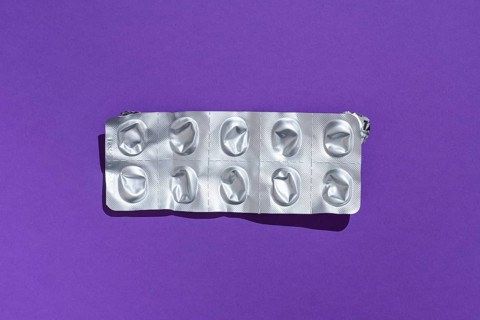 Empty tablet blister pack against a monochrome background