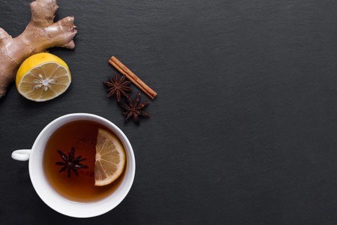 Lemon tea with ginger cinnamon beside