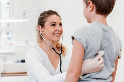 Close up pediatrician checking kid