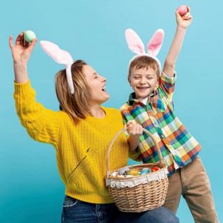 Playful mother son showing painted eggs