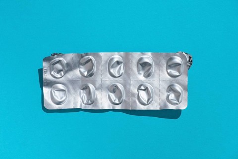 Empty tablet blister pack against a monochrome background