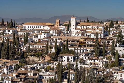 The former Moorish residential district of Albaicin with the Mirador de San Nicolas and the church of San Nicolas in Granada