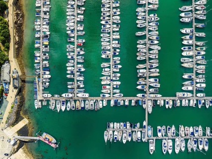 Top Down view over Boats and Yachts in Brixham Marina from a drone