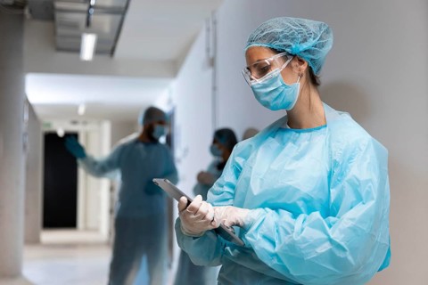 Doctor protective wear looking tablet